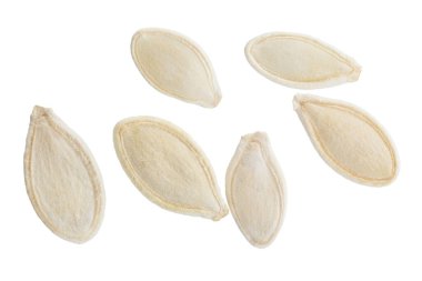 Heap of pumpkin seeds isolated on white background. File contains clipping path. Top view. Full depth of field. 