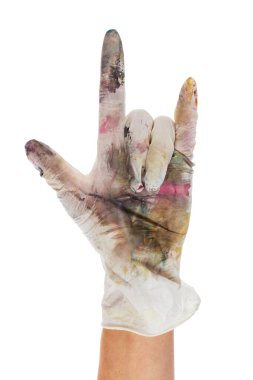Heavy metal fingers in a rubber glove stained with paints. Isolated on white background. File contains clipping path.