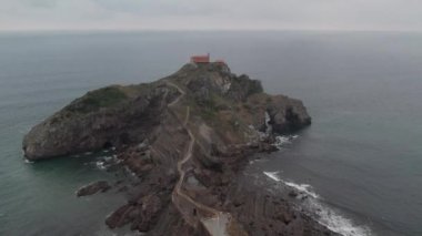 View of Hermitage of Gaztelugatxe Island in Spain filmed with a drone