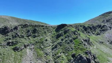 Horizontal drone shot of a mountain peak in Mercantour national park