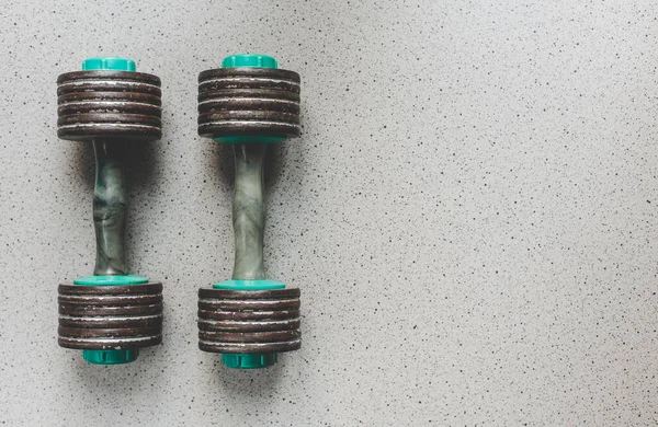 Vintage dumbbells, top view. Sport background