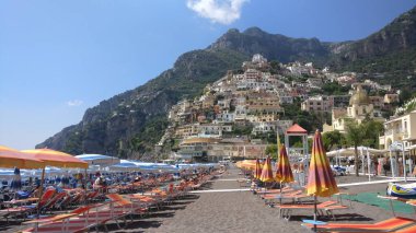 Positano Italy in season summertime early in the day ready for the visitors clipart