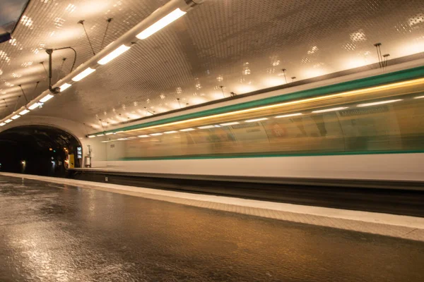 Paris, France. August 2022. A subway station with a passing train in Paris. High quality photo