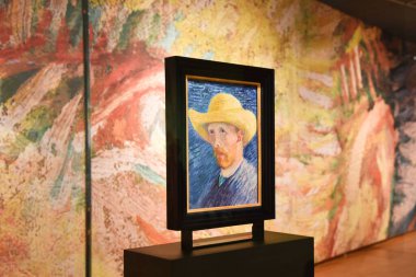 Amsterdam, Netherlands. January 2023. Visitors admiring a self portrait of Vincent van Gogh. High quality photo