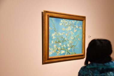 Amsterdam, Netherlands. January 2023. Visitors admire paintings by Vincent van Gogh in Amsterdam. High quality photo