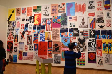 Amsterdam, Netherlands. January 2023. Visitor takes photo of a wall with protest posters in Amsterdam. High quality photo