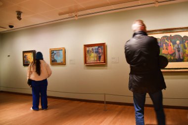 Amsterdam, Netherlands. January 2023. Visitors admire paintings by Vincent van Gogh in Amsterdam. High quality photo
