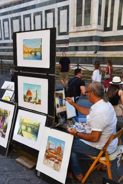 Floransa, İtalya. 17 Eylül 2023. Sanatçılar Floransa 'da turistler için resim yapıyorlar. Yüksek kalite fotoğraf