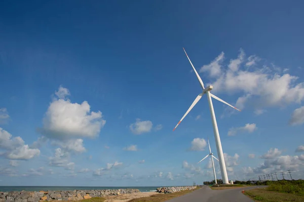 large wind turbines bring electricity from the wind Concept of energy saving, renewable energy