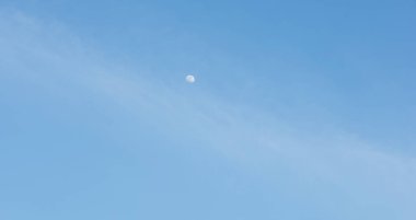 half moon on blue sky background clipart