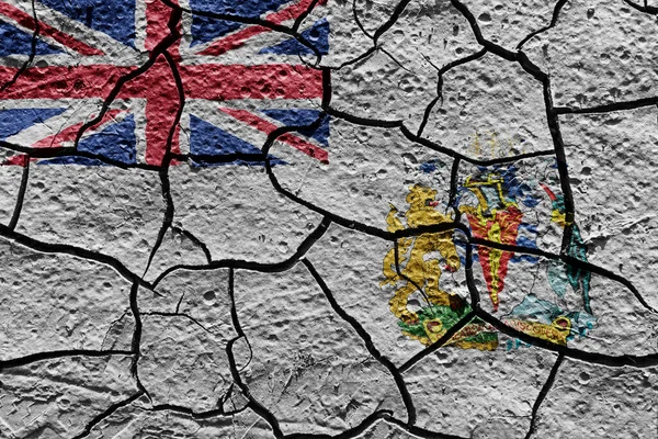 British Antarctic Territory flag on a mud texture of dry crack on the ground