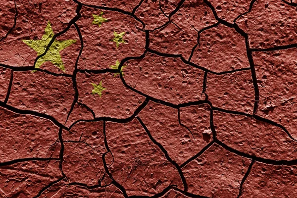 China flag on a mud texture of dry crack on the ground