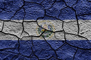 El Salvador flag on a mud texture of dry crack on the ground
