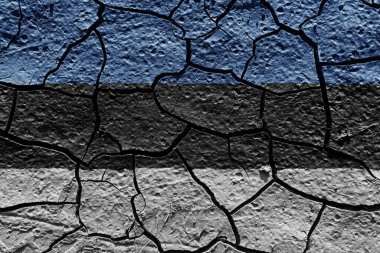 Estonia flag on a mud texture of dry crack on the ground
