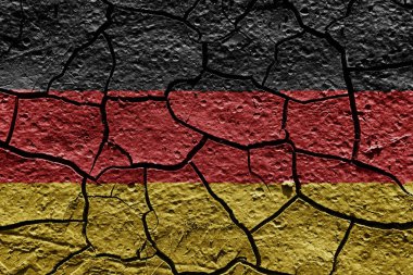 Germany flag on a mud texture of dry crack on the ground