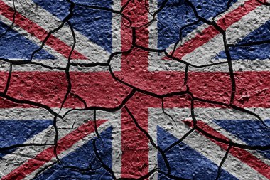 United Kingdom flag on a mud texture of dry crack on the ground