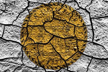 Georgia state Seal flag of United States on a mud texture of dry crack on the ground