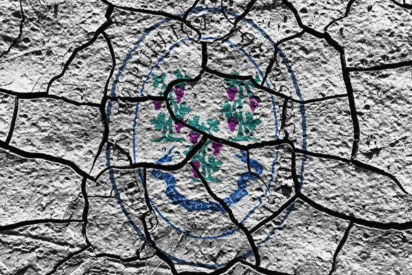 Connecticut state Seal flag of United States on a mud texture of dry crack on the ground