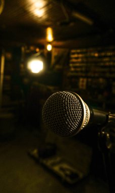 microphone placed on its stand ready to sing or say things clipart