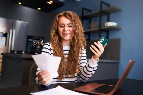 Happy Woman Using Online Banking App Pay Bills Holding Paychecks — Stock Photo, Image