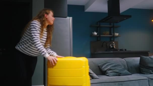 Tourist Woman Drags Her Wheeled Suitcase Hotel Check Falls Sofa — Stock Video