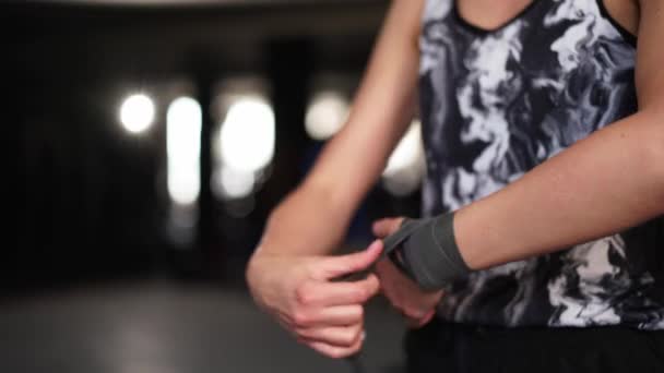 Athletic Slim Woman Wraps Hands Boxing Bandages Gym Female Athlete — Stockvideo