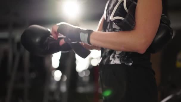 Strong Woman Puts Black Boxing Gloves Wrapped Fists Gym Caucasian — Stok video