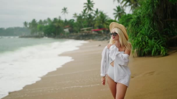 Slim Blonde Young Woman White Shirt Onepiece Swimsuit Straw Hat — Stockvideo