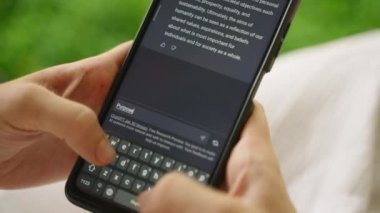 February 5, 2023, Mirissa, Sri Lanka. Using OpenAI chatGPT on phone. A woman chats with artificial intelligence. Person tests neural network language Mirissa online. Human talks to AI via GPT close-up