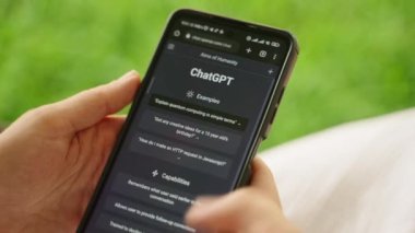 February 5, 2023, Mirissa, Sri Lanka. Using OpenAI chatGPT on phone. A woman chats with artificial intelligence. Person tests neural network language Mirissa online. Human talks to AI via GPT close-up