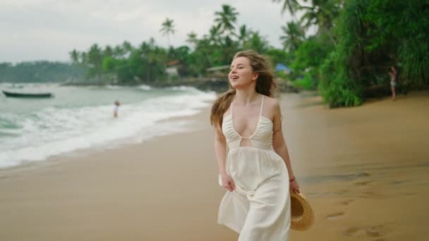 Young Curly Caucasian Woman White Dress Straw Hat Hands Walks — Stock videók