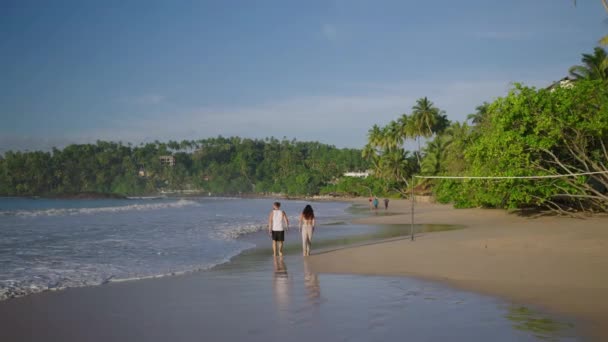 Young Biracial Happy Couple Unfocused Walking Beach Together Enjoying Summer — Wideo stockowe