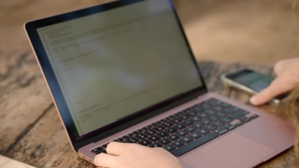 Woman Developer Working Laptop Takes Phone Diagrams Checks Statistics Woman — Video Stock