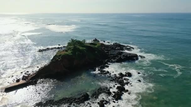 Green Tropical Rocky Island Middle Blue Green Sea Washed Waves — Stock Video