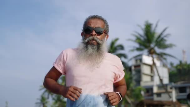 Elderly Senior Runner Man Grey Beard Checks Health State Uses — Stock Video