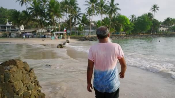 Elderly Senior Man Beard Walking Water Sea Shore Travels Alone — Stock Video