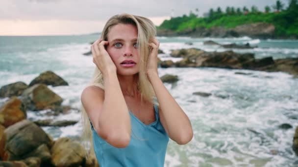 Blonde Hair Serene Gaze Touching Face Waves Crash Woman Blue — Stock Video