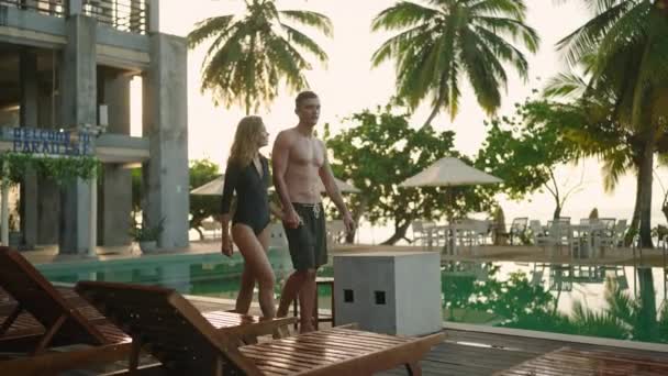 Young Couple Swimsuits Walking Swimming Pool Luxury Resort Hotel Ocean — Stock Video