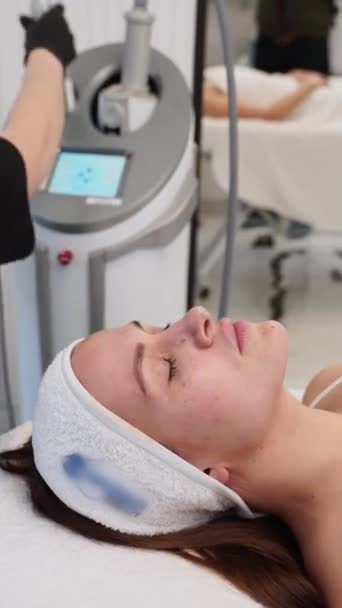 Relaxed Female Undergoing Ageing Treatment Skin Rejuvenation Professional Aesthetician Performs — Stock Video