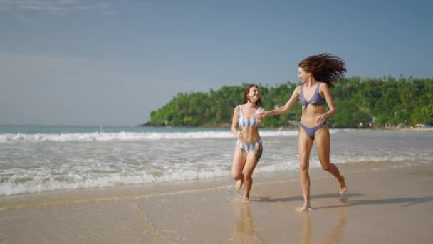 Young Fitted Women Swimwear Holding Hands Running Sea Water Edge — Stock Video