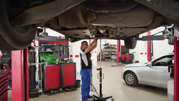 Worker Fits Transmission Conducts Clutch Maintenance Lifted Car Auto Mechanic — Stock Video