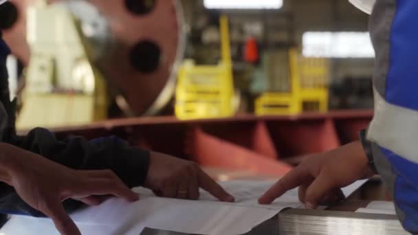 Team Consults Machinery Specs Hands Point Diagrams Engineers Workers Analyze — Video