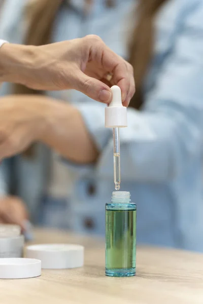 stock image Close-up of a womans hand testing a skin cream in a pharmacy