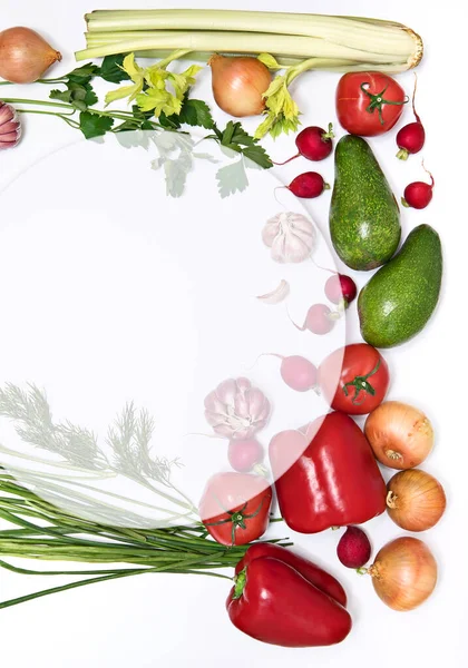 Layout, template with a circle consisting of vegetables isolated on a white background. Healthy food concept, organic foods enriched with vitamins and fiber, top view, central copy space, vertical