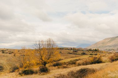 Landscape view of hills and mountain and far city of Korce, Albania