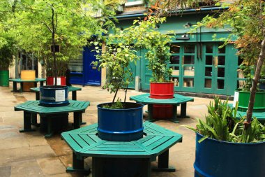 Colorful Planters and Benches in Neal s Yard, London, UK. Vibrant Courtyard with Lush Greenery and Urban Charm. High quality photo clipart