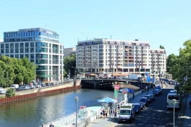 Berlin, Germany - July 2 2015: Modern Buildings and Riverside Scene in Berlin on a Sunny Day. High quality photo clipart