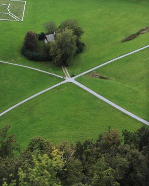 Intersecting Pathways in Green Countryside with a Small Cottage, Surrounded by Trees and Open Fields, Viewed from Above, Depicting Rural Life and Nature s Calm. Salzburg, Austria. High quality photo clipart