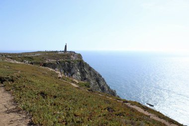 Cape Roca Cliff Viewpoint with Ocean Horizon and Tourists. High quality photo clipart