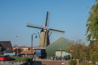 old flour windmill in the village of Ouddorp on the island of Goeree Overflakkee in winter